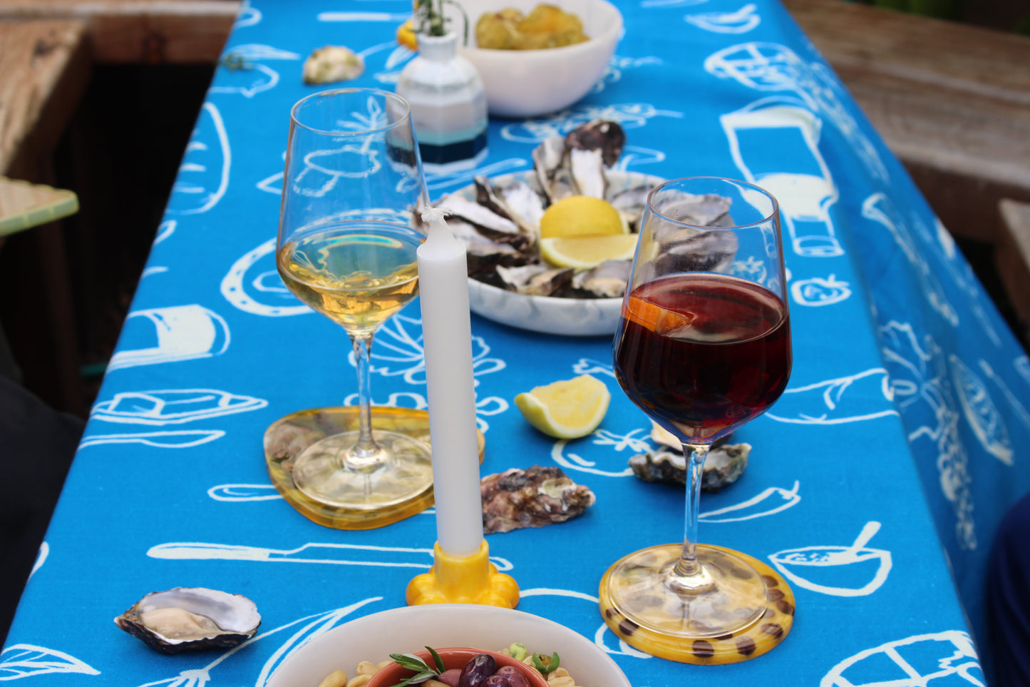 Blue Feast Tablecloth - table with food and wine