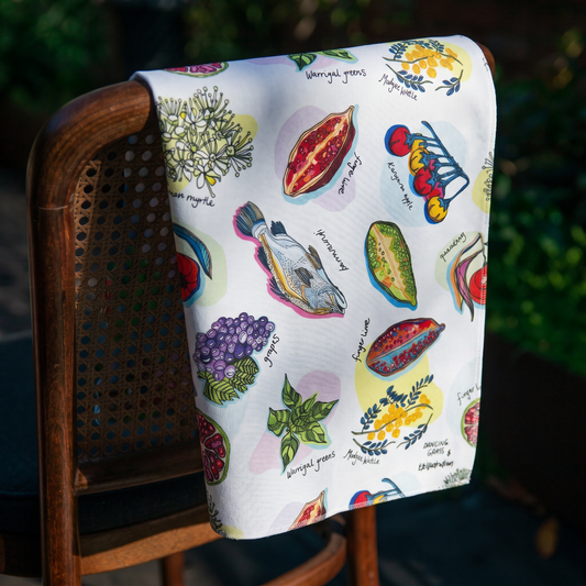 Colourful towel with illustrations of bush foods from australia.
