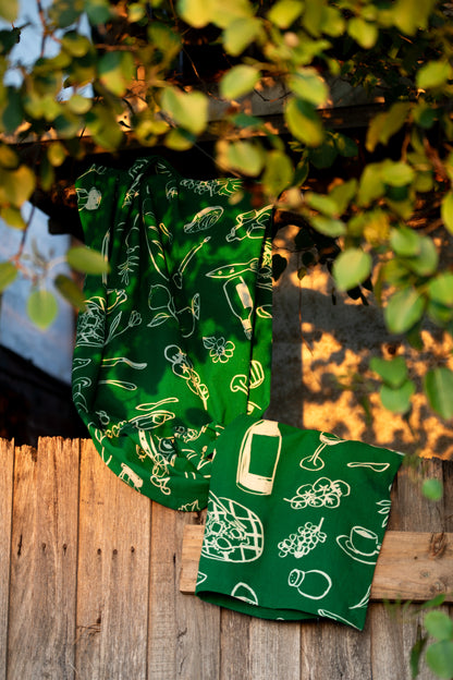 green tablecloth displayed in nature among the trees 