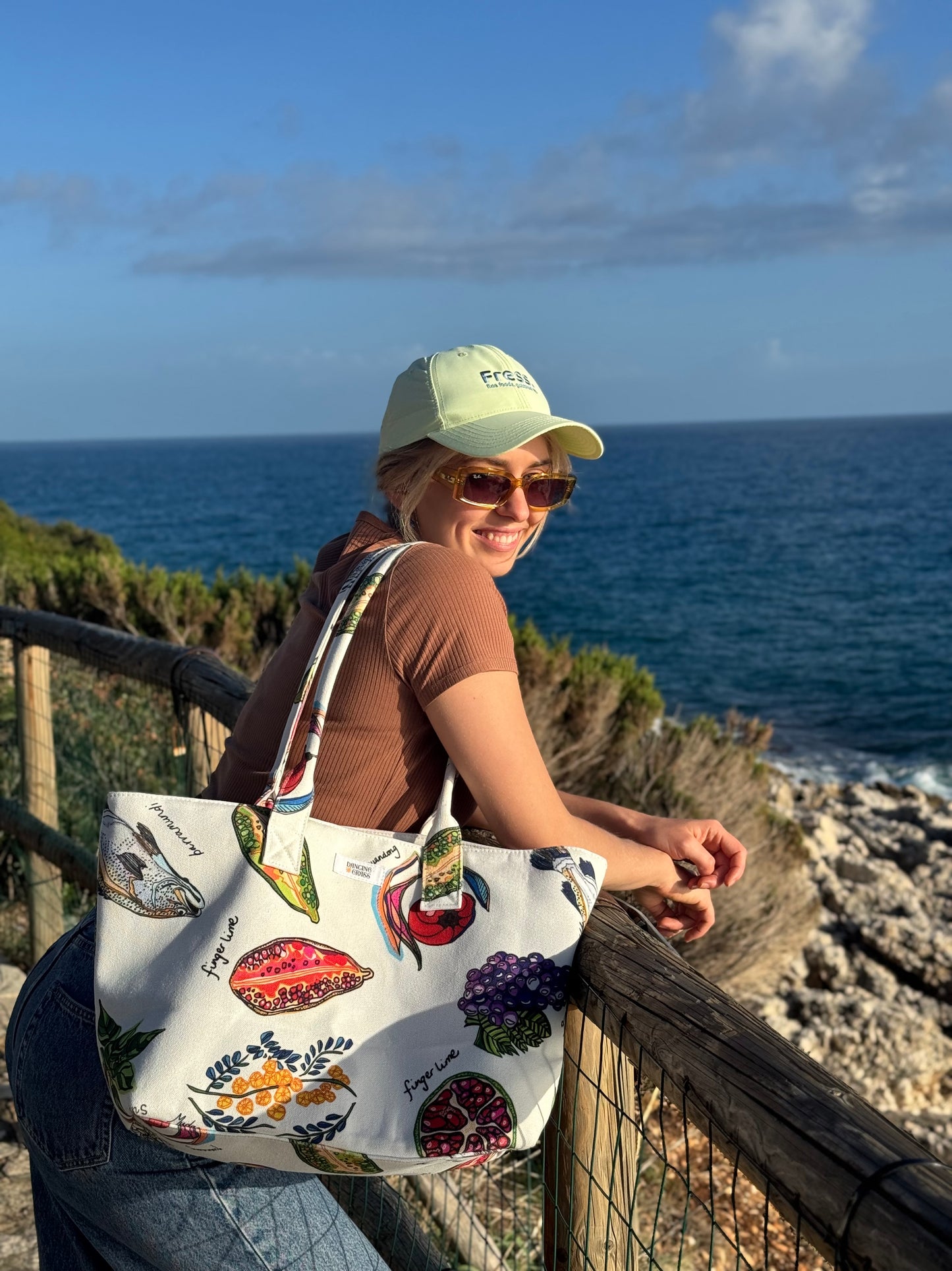 Australian-designed canvas tote bag with native bush food illustrations used as a beach bag, structured cotton tote for everyday use, market shopping, coastal lifestyle and summer outings
