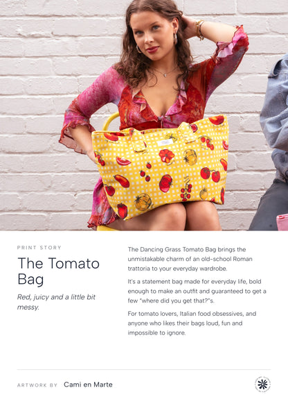 The Tomato Bag print story: woman seated by a white brick wall with the Italian Tomato Dancing Grass bag on her lap