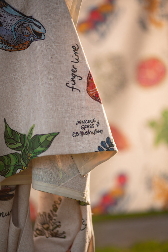 home grown hand made and designed tablecloth, showcasing colourful illustrations of kangaroo apples, finger lime, and other native Australian produce